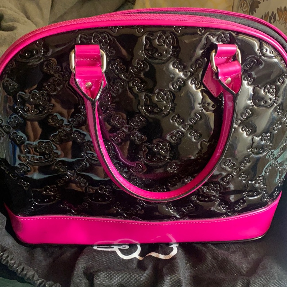 Hello kitty pink and black loungefly purse